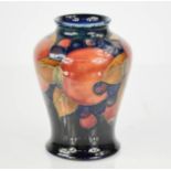 A Moorcroft baluster vase, in the pomegranate pattern, with impressed Cobridge factory mark and blue