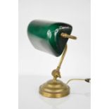 A 1940's desk lamp with green glass shade, 35cm high.