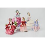 A group of four Royal Doulton Ladies Daydreams HN1731, Autumn Breeze HN4716 18cm high, Lydia HN1908,