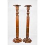 A pair of Edwardian mahogany torcheres. 123cms tall