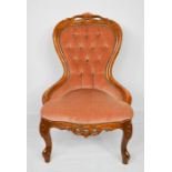 A Victorian beech nursing chair, with buttoned back. 91cms tall