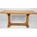 A Robert Thompson The Mouseman coffee table, carved with the trademark mouse to the leg, 45 by 91 by