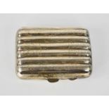 A silver cigarette case, Chester 1915, fluted form and engraved with decoration, 2.49toz.