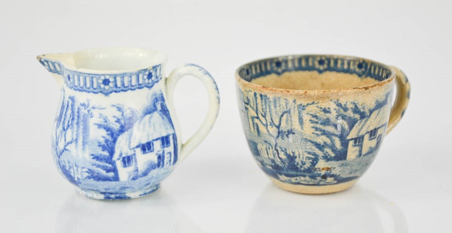 A small Victorian blue and white jug depicting cottage and bridge over a river, together with a