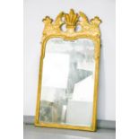 An 18th century giltwood wall mirror / pier mirror, with crested top, 113 by 57cm.