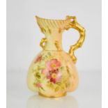 A Royal Worcester jug, painted with flowers, with gilded handle and highlights, blush ivory,