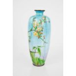 A Japanese champleve vase, depicting prunus blossom on a blue ground, 18cm high.