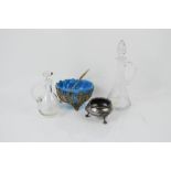 Two antique glass bottles, a blue glass bowl and salt.