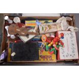 A child's / toy umbrella 44cm high, and two small dolls, along with vintage games and cards to