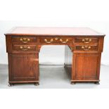 A Victorian twin pedestal desk with red leather top. 77cms tall x 142cms wide x 89cms deep