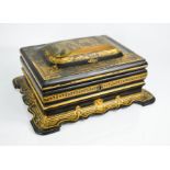 A 19th century papier mache sewing box, the interior compartments containing ivory and mother of