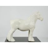 A Beswick white glazed shire horse, 22cm high.
