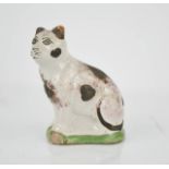 A naive terracotta faience type cat, hand painted with detail, 14cm high.