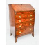 A fine Georgian mahogany child's bureau, the fall front enclosing a fitted interior and well, the