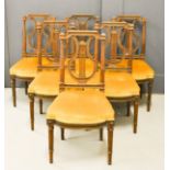 A set of six 19th century mahogany chairs, with lyre form backs, and yellow ochre velvet upholstered