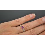 A 14ct white gold, pink sapphire and diamond ring, the sapphire approximately 0.5cts, size O½, 3.