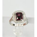An 18ct white gold, rhodolite garnet and diamond ring, the garnet approximately 3cts, the diamonds