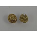 Two Indian gold Travancore Fanam coins. [The Travancore Fanam was a type of money that was issued by