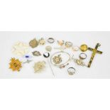 A group of collectables to include rings, badges, crucifix, silver bangle, miniature zippo, mother