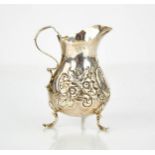 A silver jug, Chester, embossed with shell and floral decoration.