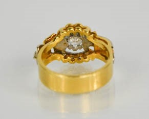 An 18ct gold buckle ring, centred by a diamond approximately 0.75cts and set with twelve further - Image 3 of 5