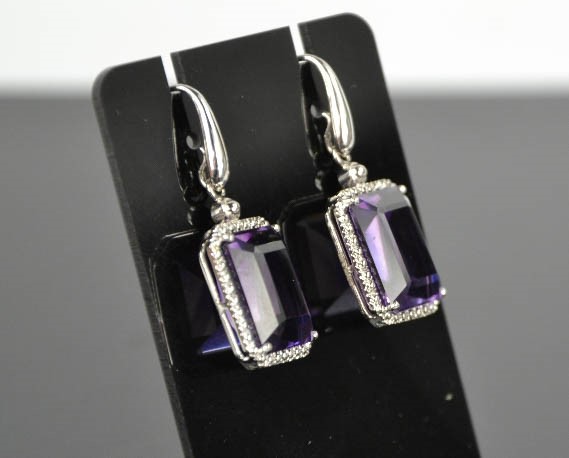 An 18ct white gold, diamond and amethyst drop earrings, the cushion cut amethysts bordered by - Image 2 of 7