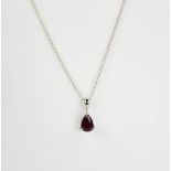 An 18ct white gold and ruby pendant and chain, the pear cut ruby approximately 1.01ct, 2.5g.