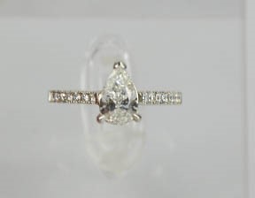 A platinum and diamond ring, the pear cut central diamond 1ct, FVS2, the shoulders set with diamonds - Image 5 of 6