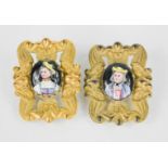 A pair of 19th century Dutch gilt metal portrait brooches, the enamel hand painted oval central