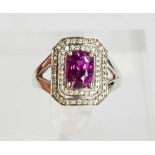 An 18ct white gold, pink sapphire and diamond ring, the sapphire approximately 2cts, the diamonds