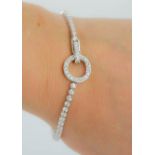 An 18ct white gold and diamond bracelet, the roundel and clasp also set with diamonds, stamped
