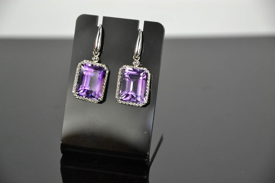 An 18ct white gold, diamond and amethyst drop earrings, the cushion cut amethysts bordered by - Image 3 of 7