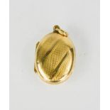 A 9ct gold oval pendant photograph locket, with machine engraved decoration, 3.4g.