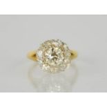 A late Victorian old cut diamond, yellow gold and platinum twelve-stone round cluster ring, the