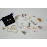 A group of silver and gilt silver jewellery, including earrings, necklaces, pendants set with