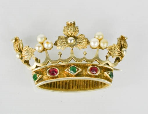 A gilt metal, pearl and paste stone brooch in the form of a crown, 5cm by 2.5cm.