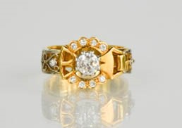 An 18ct gold buckle ring, centred by a diamond approximately 0.75cts and set with twelve further - Image 5 of 5