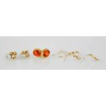 A 9ct gold and amber pair of stud earrings, a 9ct gold, blue topaz and diamond earrings, and a