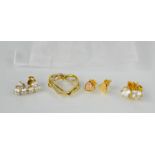 Three pairs of gilded silver stud earrings: one pair of heart form, together with a twin heart