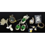 A group of jewellery, mostly silver, including a ring, earring and pendant set, a dragon and pearl