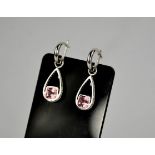 An 18ct diamond and pink tourmaline and diamond drop earrings, the pink tourmaline approximately 3.