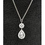 An 18ct white gold, and diamond necklace, the pear shaped pendant diamond approximately 0.31ct