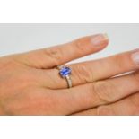 An 18ct white gold, diamond and sapphire ring, the sapphire approximately 0.80ct, with diamond set