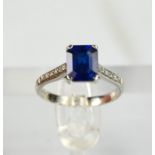A platinum, blue sapphire and diamond ring, the sapphire approximately 1ct, the diamonds measuring