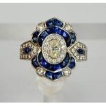 An impressive Art deco style diamond and sapphire ring, the diamonds totalling approximately 1ct,