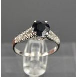 A 14ct white gold, black sapphire and diamond ring, size M, 2.3g.