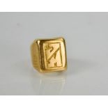 A gold signet ring, (unmarked, tested as 18ct), size I/J, 9.7g.