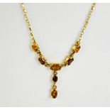 A 9ct gold, citrine and garnet necklace, 4.4g.
