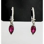 A pair of 18ct white gold sapphire and diamond earrings, the sapphire approximately 1.40ct, the