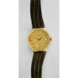 A Gentleman's 9ct gold Tissot wristwatch, circa 1950, with gold coloured dial, and leather strap.